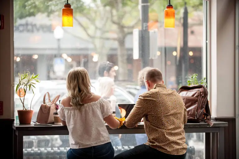 Nick Beecher of Brands That Last working on a laptop at a café window